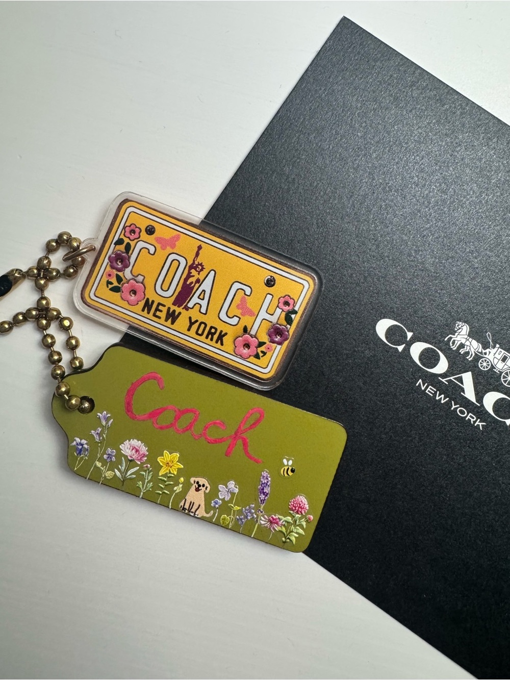 Sold Coach green tag with dog and flower and tea rose license plate charm